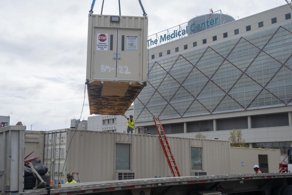 A shipping container, part of The Medical Centers temporary medical unit, gets prepared for transport to Atlanta in November 2023.