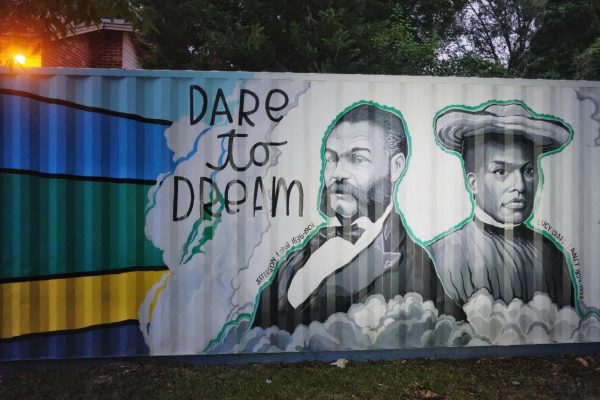 U.S. Rep. Jefferson Long (left), the first Black congressman of Georgia, and pioneering educator of Black children Lucy Craft Laney (right) are depicted in a mural by artist Kevin Lewis in Macons Pleasant Hill neighborhood which both at one time called home.