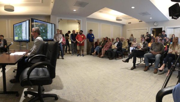Engineer Steven Rowland addresses the Macon-Bibb County Planning & Zoning Commission about a proposed high-density cluster development on Lamar Road as an overflow crowd looks on. 