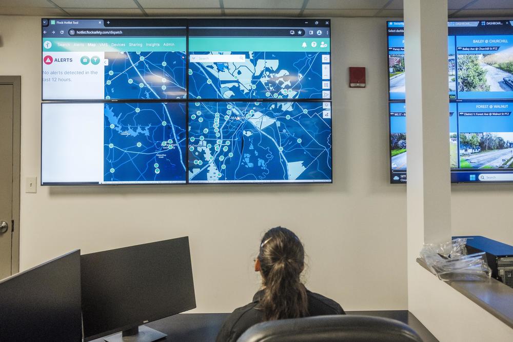 A map shows the location of the cloud-connected surveillance cameras belonging to Bibb County, as seen in the control room of the Bibb County Sheriff's Office. When their owners agree to add their private cameras, those will show up as tiny red dots.