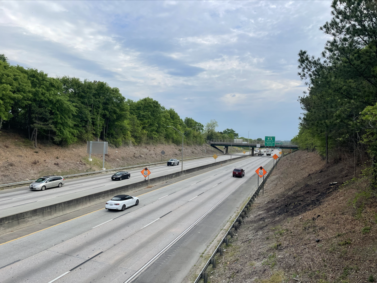 Cars drive towards the I-16/I-75 interchange construction zone in Macon.