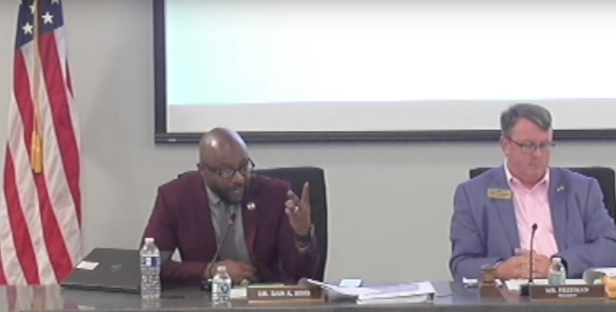 Bibb County School District Superintendent Dan Sims fields questions from school board member Daryl Morton about proposed raises for certain administrative positions.