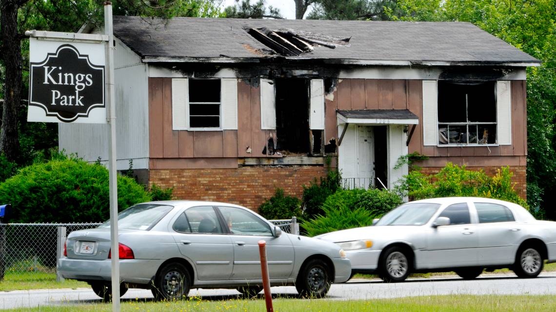 The burned out house at 3206 Kings Park Circle greets visitors to Kings Parks. File from September 2014.
