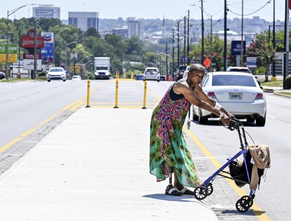 Janice McCrary uses the new medianettes on Gray Highway one sweltering afternoon in August 2024. The 59-year-old lives in an apartment at McAfee Towers and was on the way back from eating lunch at Dairy Queen. 