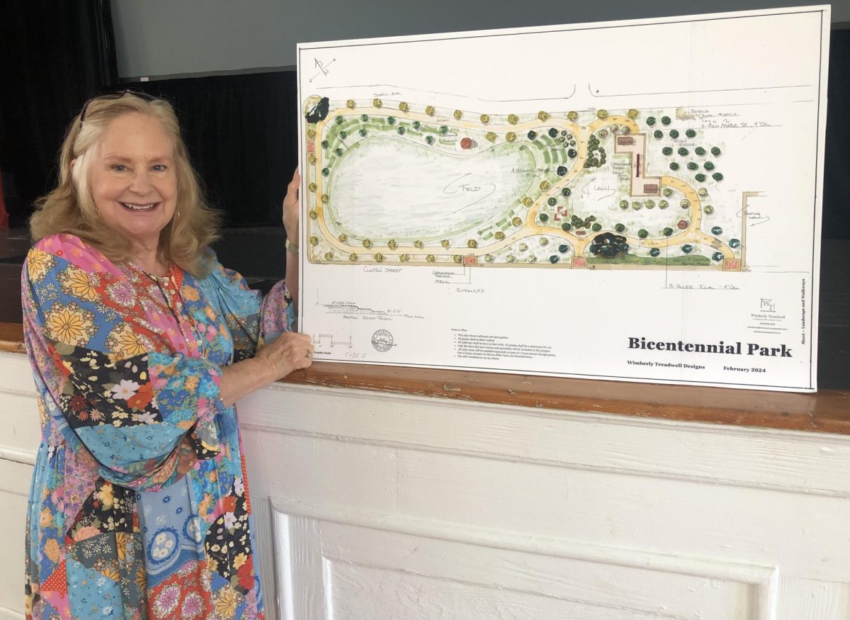 Landscape architect Wimberly Treadwell displays the design for Macon's Bicentennial Park near the East Macon Mill Hill Community Arts Center. 