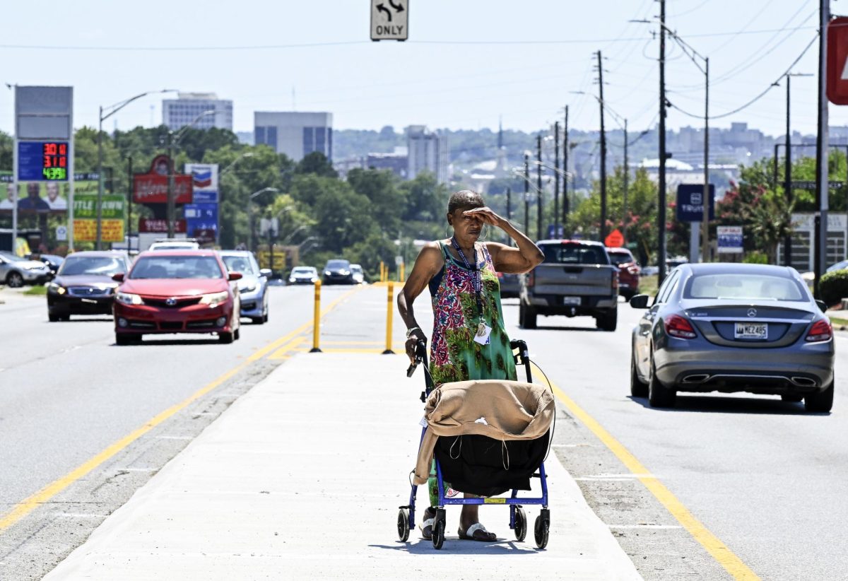 Janice McCrary uses the new medianettes on Gray Highway one sweltering afternoon in August 2024. The 59-year-old lives in an apartment at McAfee Towers and was on the way back from eating lunch at Dairy Queen. 