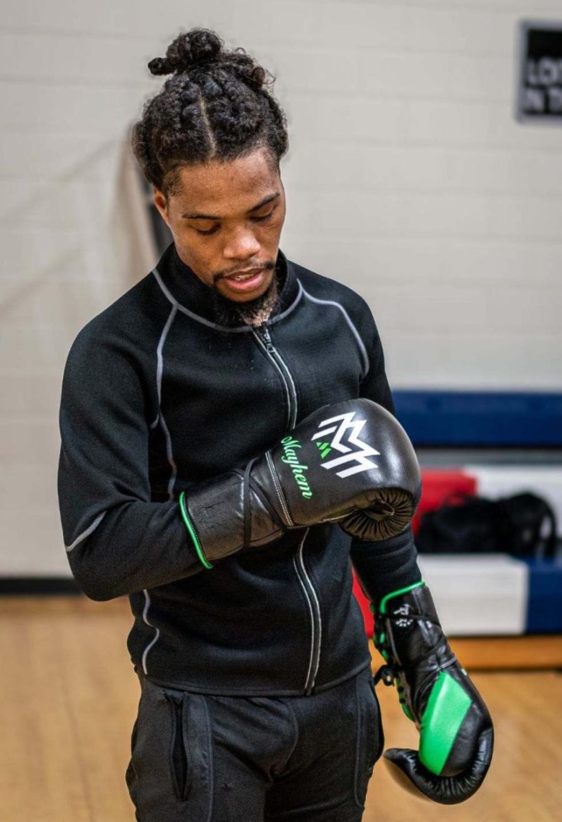 Maliek Montgomery poses outside of the boxing ring at Macon-Bibb United Boxing Club.