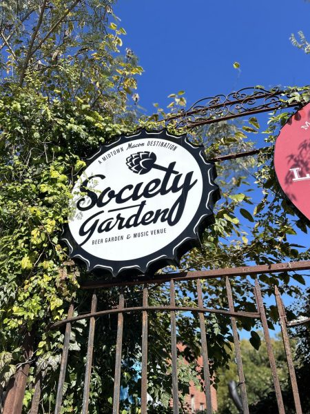 A photo taken of the Society Garden's sign located on the front gate of the venue.