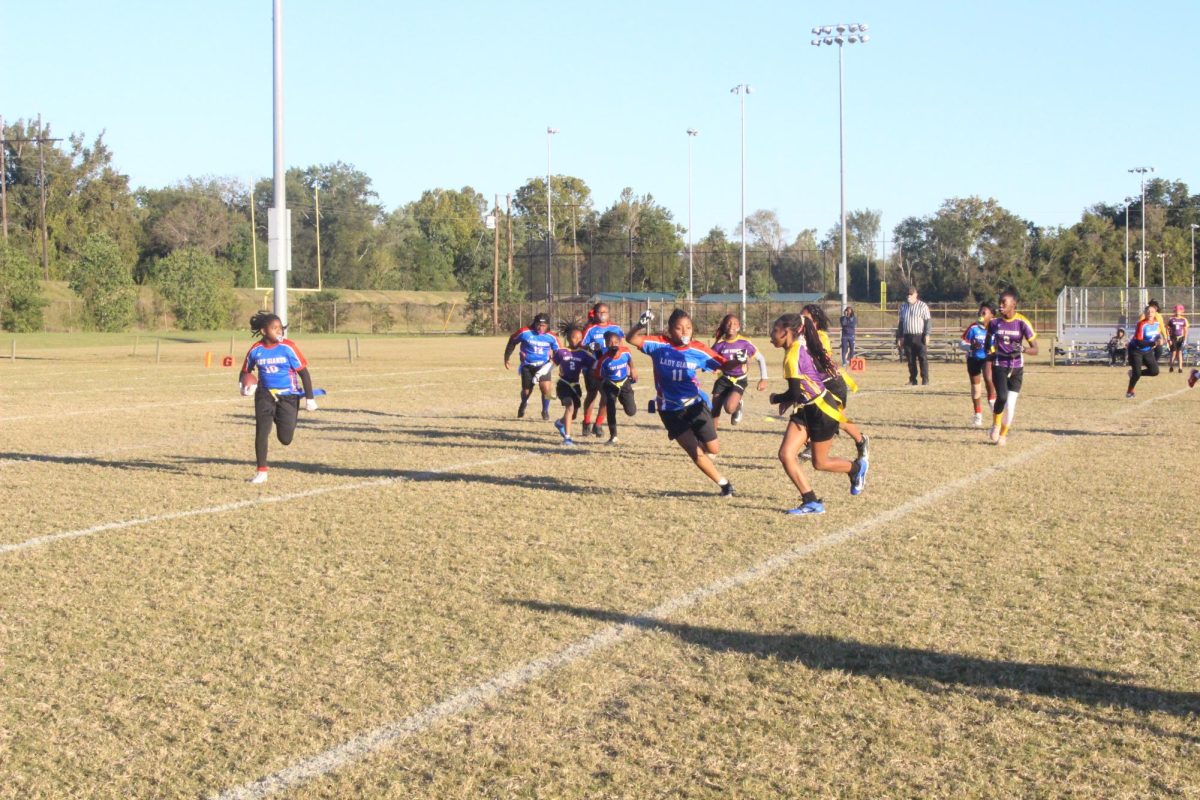 The Lady Giants face off against Lady Vikings in Macon-Bibb County girls' flag football league during the inaugural 2024 season.