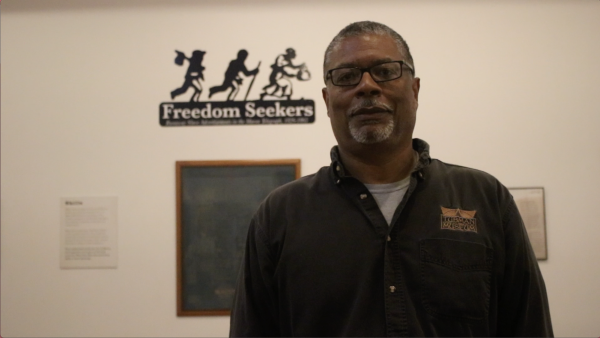 Jeff Bruce curator at the Tubman Museum in Macon, Ga. He is shown here outside of the Freedom Seekers exhibit, which features copies of newspaper ads on runaway enslaved people.