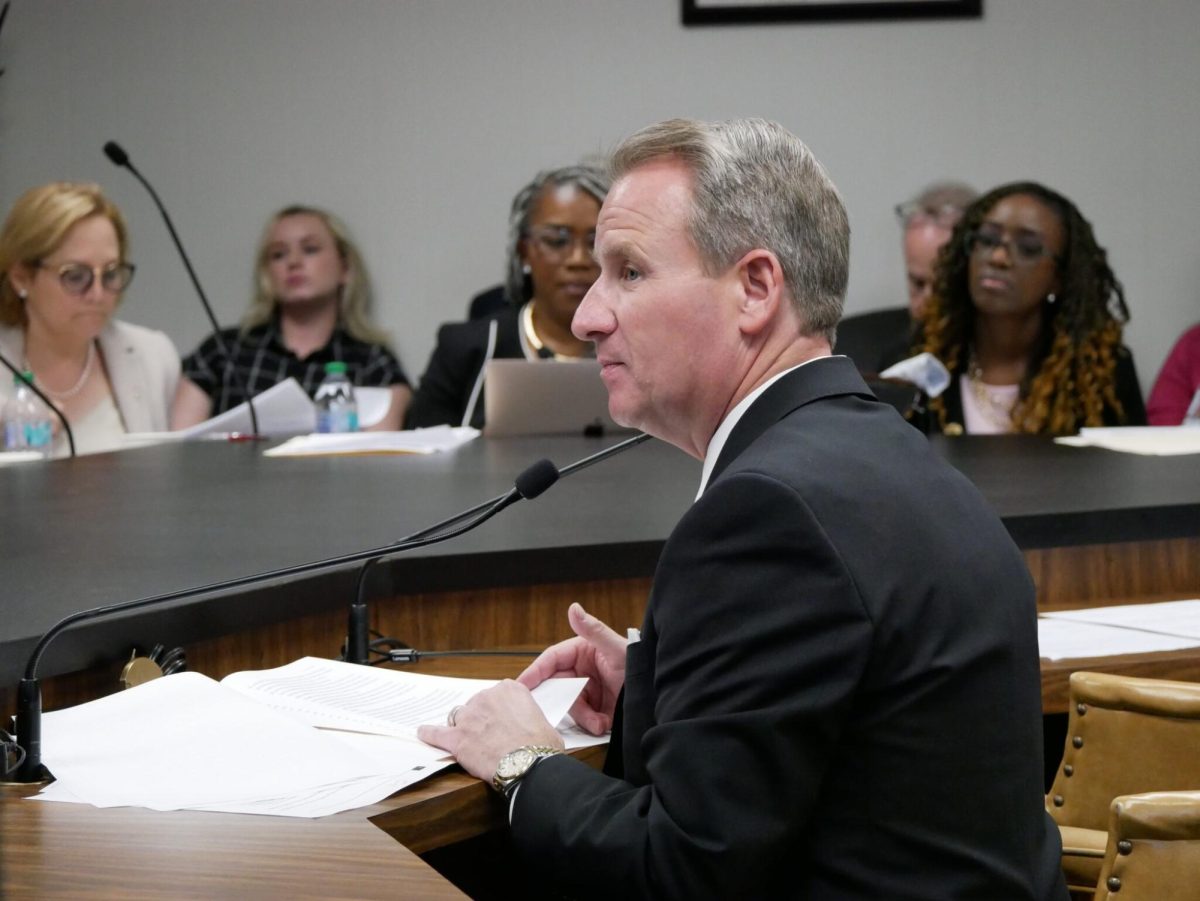 Sen. John Albers, a Roswell Republican, presents his case for making doxxing a crime – including a felony in some cases – in Georgia at a committee meeting Tuesday.