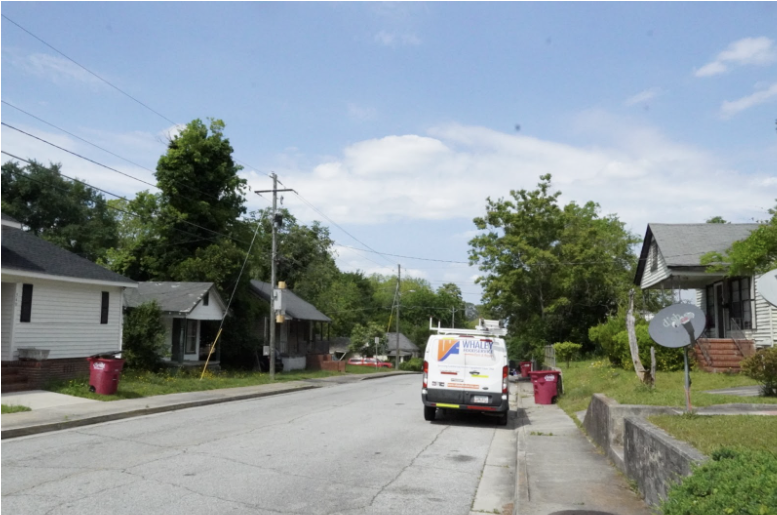 A view of the Pleasant Hill Neighborhood, where limited tree canopy leaves much of the area exposed to the sun, reflecting the challenges of urban environmental change. If trees are present many are overgrown and untamed