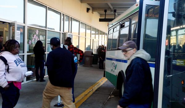 People get off and on the buses at the Terminal Station in downtown Macon, Ga. 