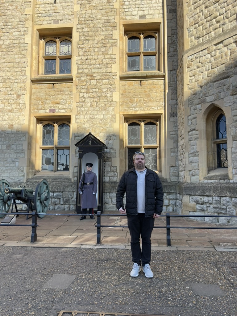 Dr. Miller recreates the guards at Tower Hill's stiff pose. (March 2025)