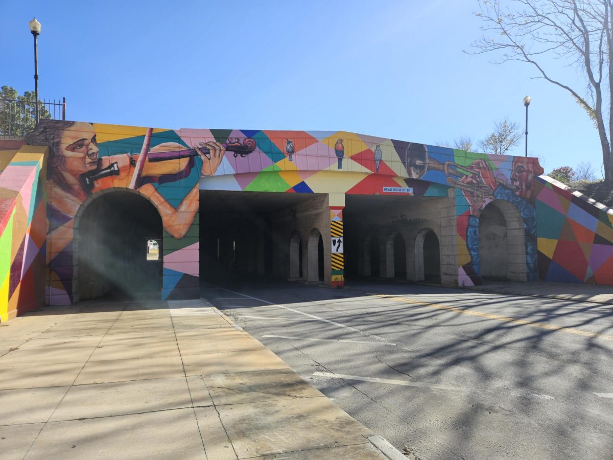 The "Spirit of Macon" mural, painted by Abraham Abebe, located over Poplar Street.