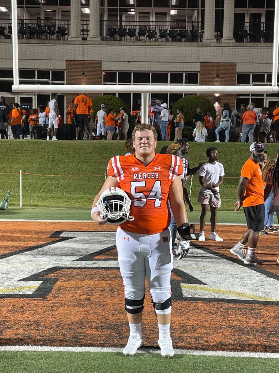 Justin Brett, Mercer football player, poses after game.