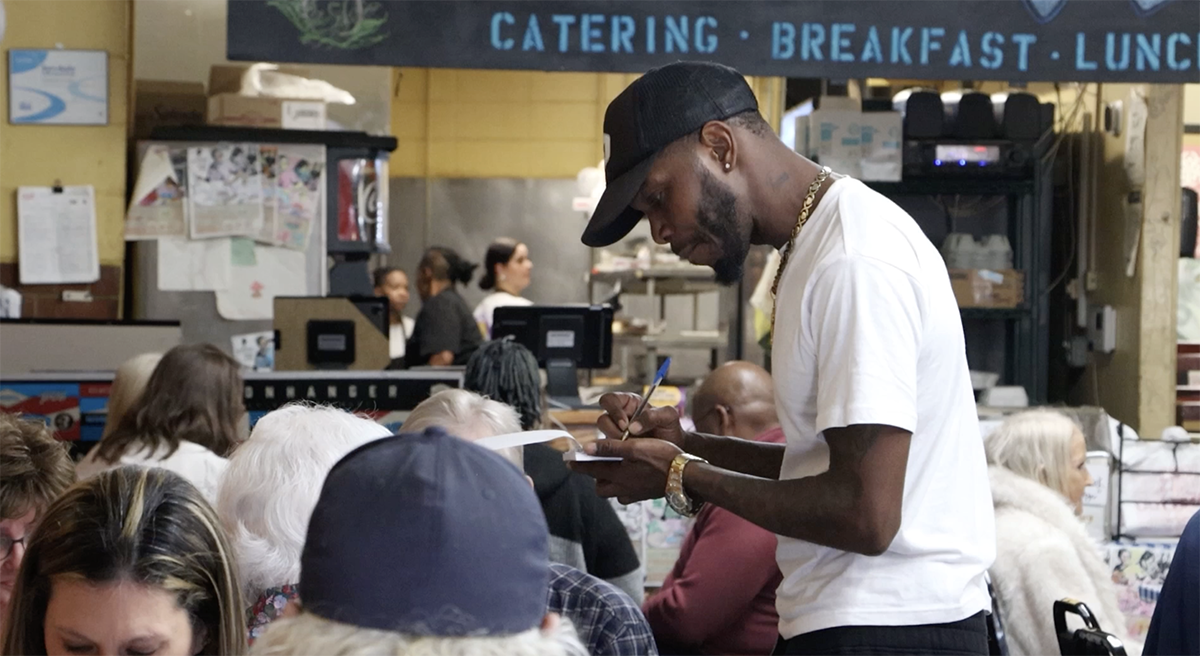 A server takes an order at H&H in downtown Macon, Ga. 