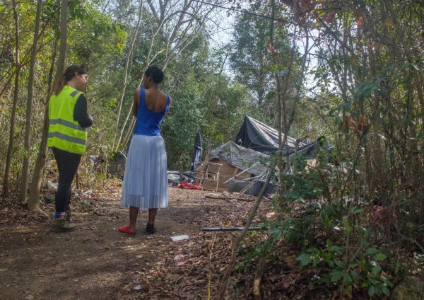 Heather Sims, left, conducts an interview at a homeless encampment in east Macon during the 2024 Point in Time count.