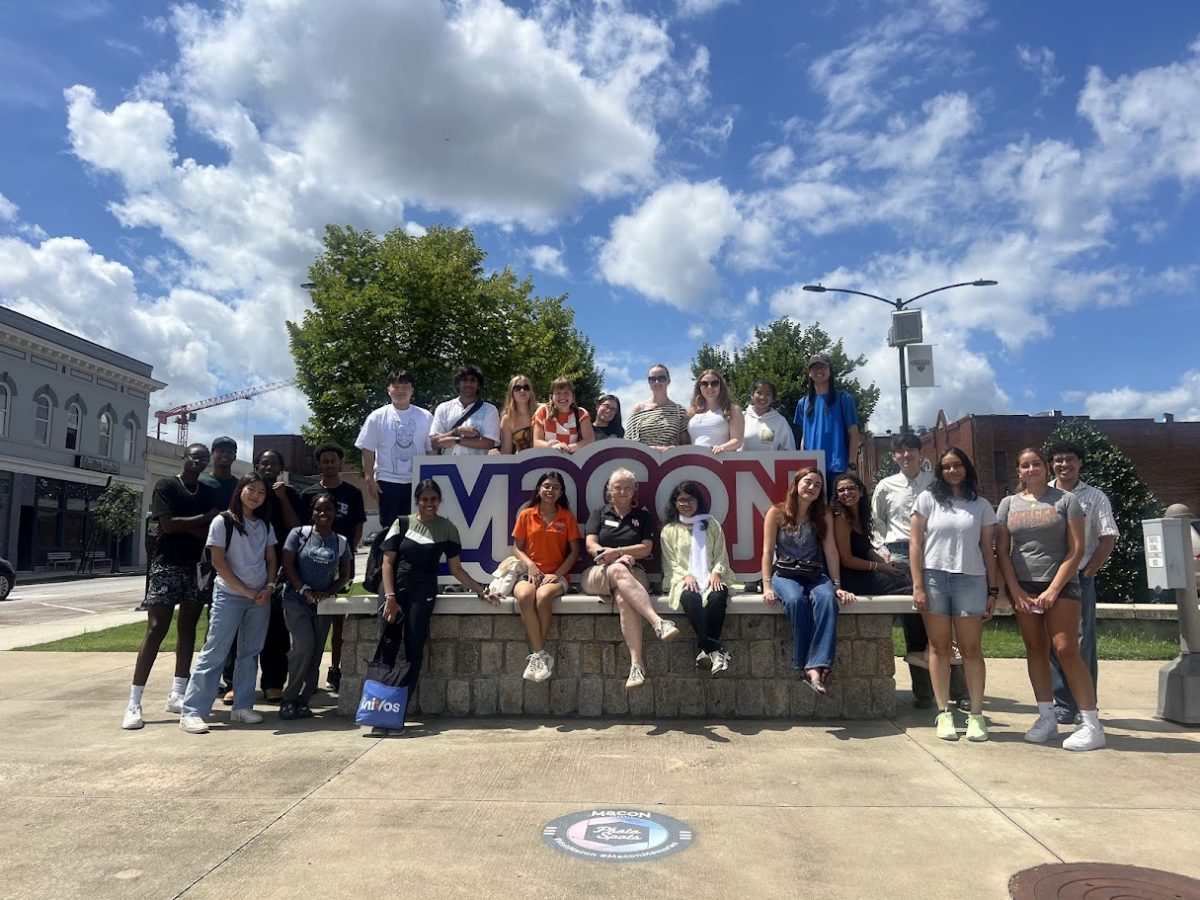 Students from Mercer University stand next to the Macon sign in Downtown Macon on September 2, 2025. 