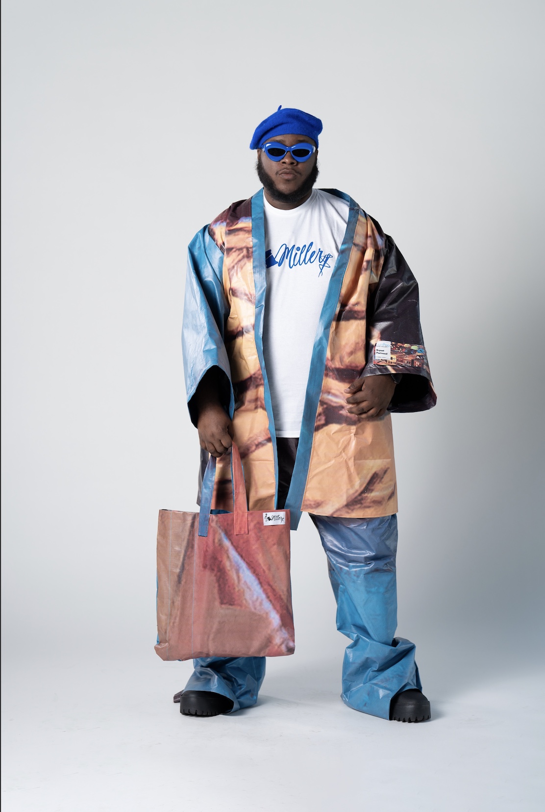 Isiah Miller posed for portrait. Miller designed everything he wore. 