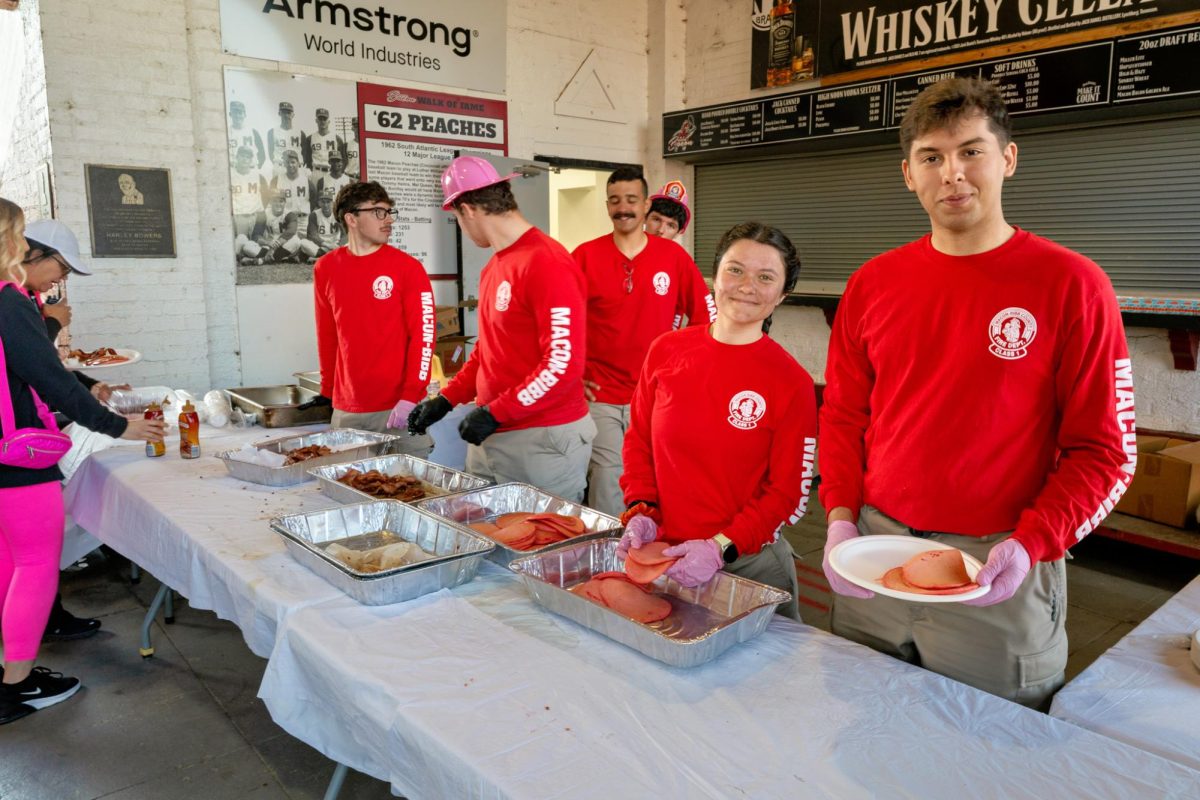 Macon Bibb County Fire Department serve breakfast to the guests that are attending the Pink Pancake Breakfast.  