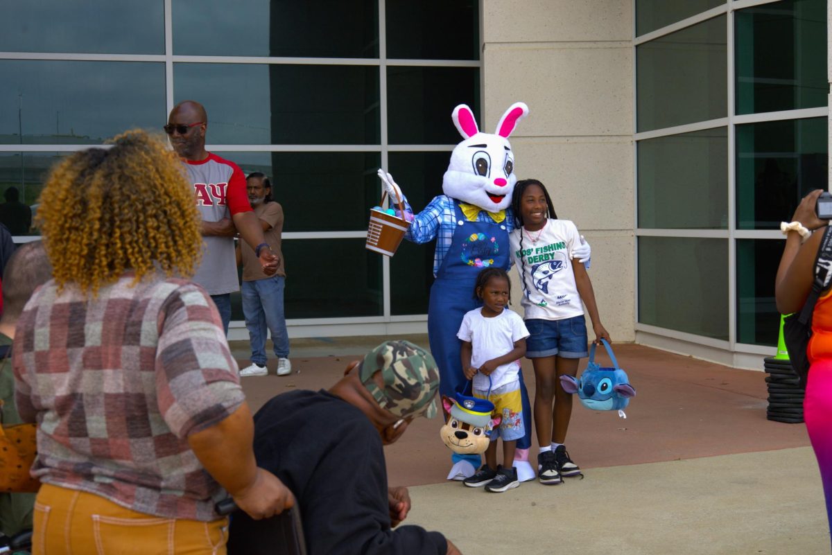 Children pose with the Easter Bunny outside the  Edgar H. Wilson Convention Center in Macon, Ga. Saturday, April 4, 2026 for the 42nd annual Egg Hunt and Family Fun Fest.