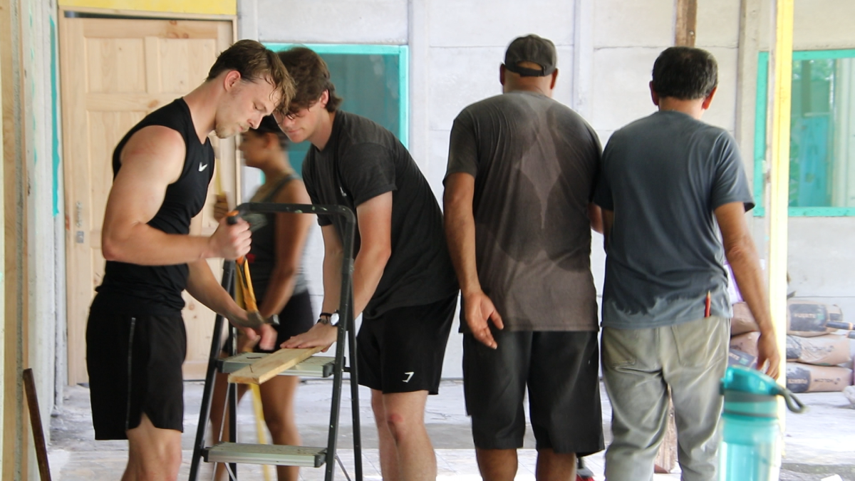 Mercer students Christopher Fields and Eli Walton help locals with repairs at Estacion Las Tortugas. The students are in Costa Rica for a Mercer On Mission.