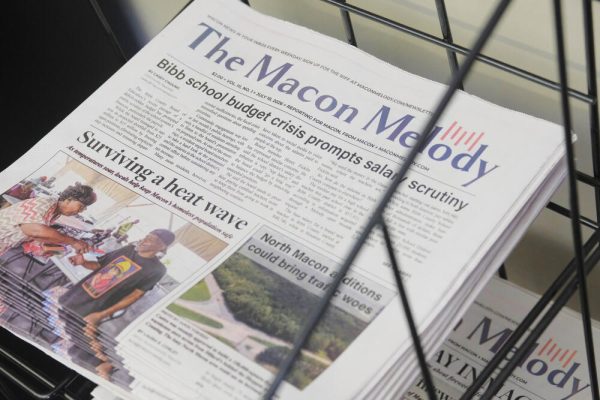 Recent issues of the Macon Melody are stacked in a rack in the Melody newsroom. The nonprofit startup newspaper will become a section of the Macon Telegraph now that the Melody's nonprofit parent company bought the older paper.